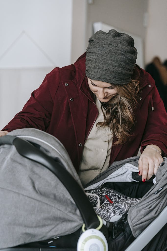 Plus size parent comfortably pushing a wide handlebar travel system stroller outdoors