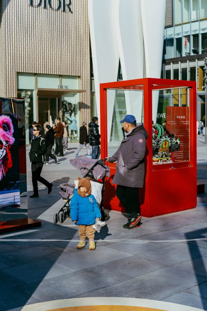 Parent walking with toddler showing when should a child stop using a stroller