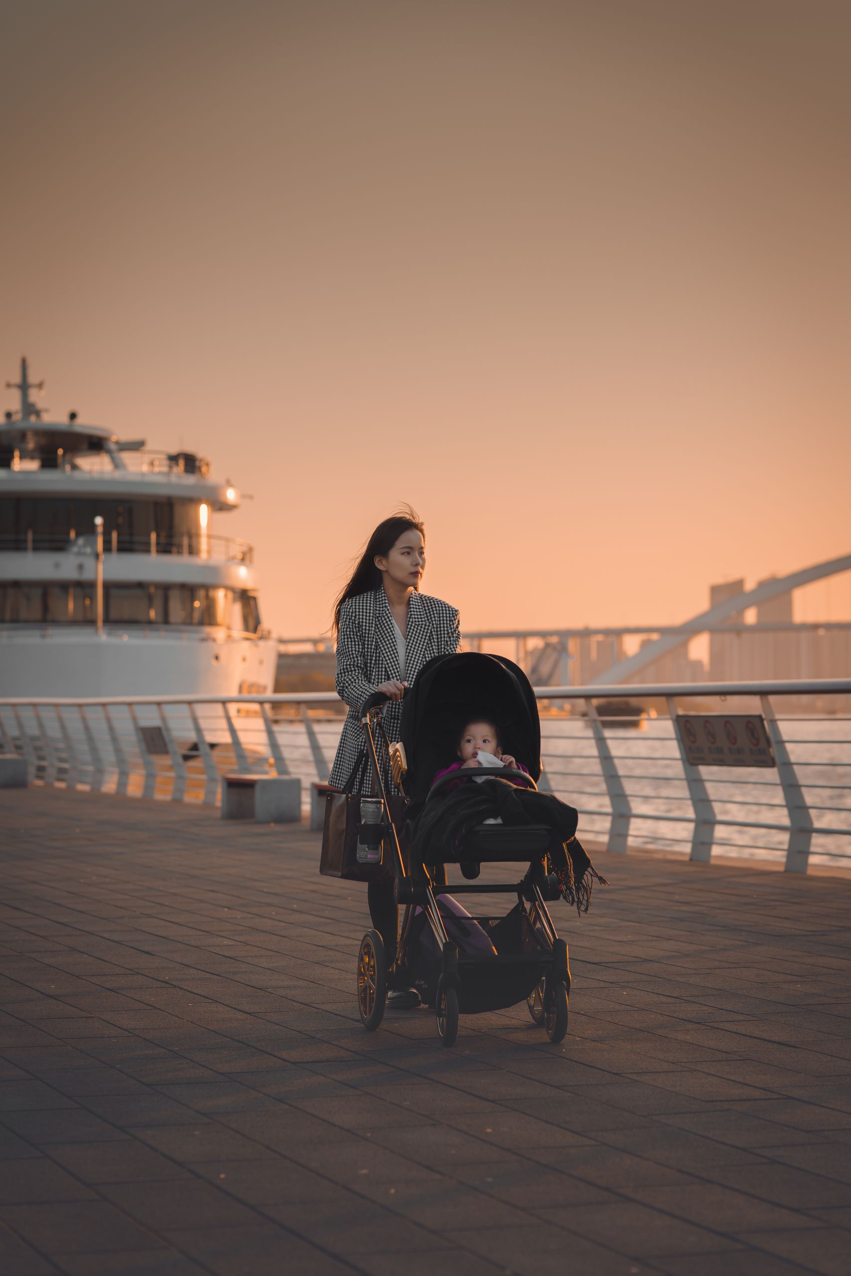 Best strollers for city living displayed on an urban sidewalk with parents walking through downtown.